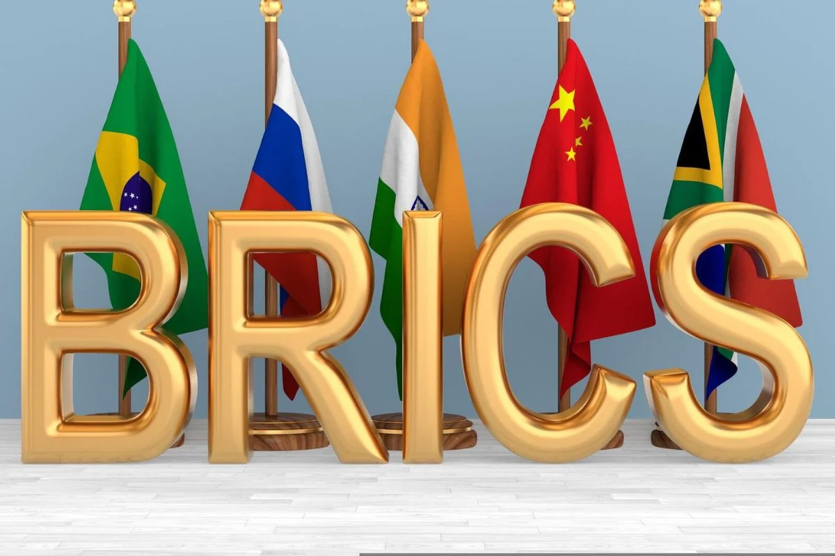 BRICS logo featuring flags of Brazil, Russia, India, China, and South Africa in a circular arrangement.