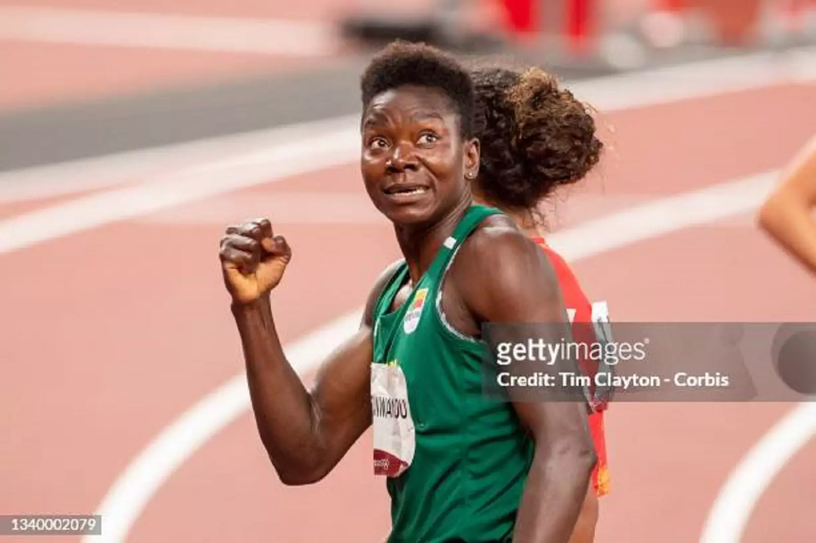 Odile Ahouanwanou posing for a portrait, smiling confidently at the camera.