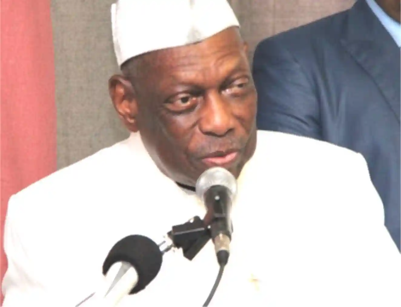 Portrait of Professor Albert Tevoedjre, an academic figure with glasses and a thoughtful expression.