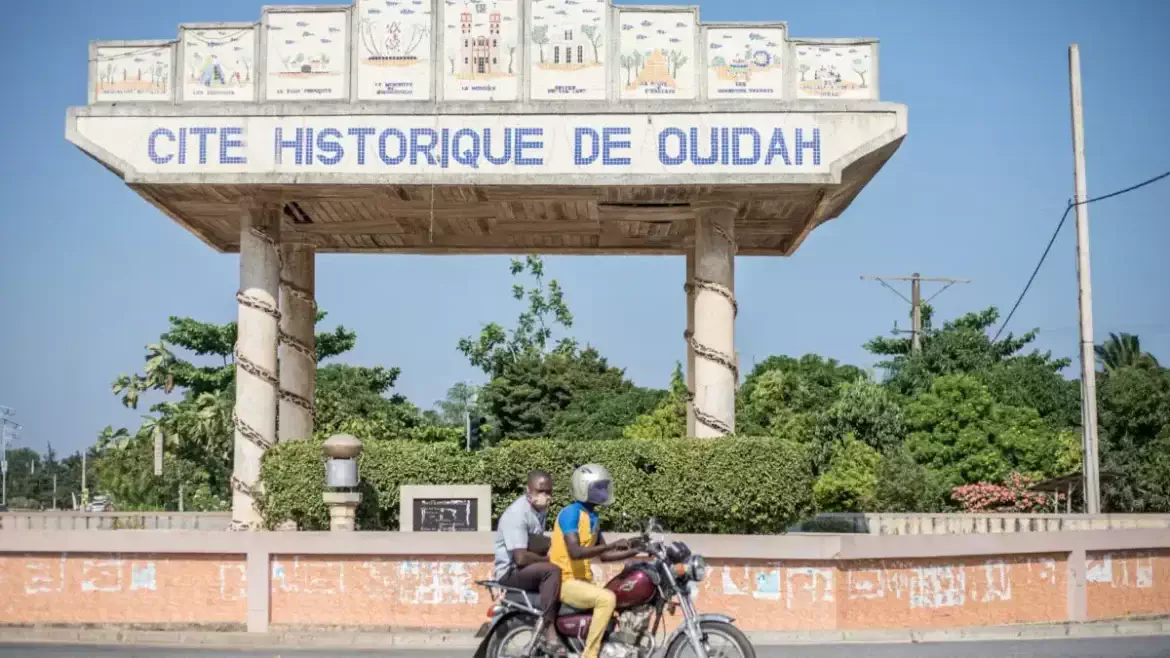 Entrance monument to the Historic City of Ouidah, now demolished, showcasing cultural significance.