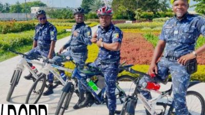 Police officers conducting bicycle patrols in Cotonou's 5th arrondissement for enhanced security.