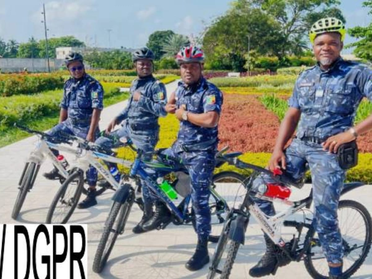 Police officers conducting bicycle patrols in Cotonou's 5th arrondissement for enhanced security.