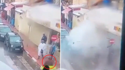 L'homme à la veste marron explose au moment où le policier se tourne vers lui.